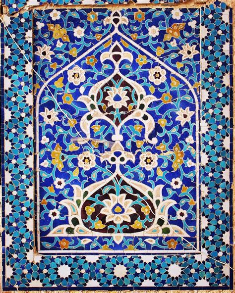 An Intricate Tile Work With Blue And Gold Colors