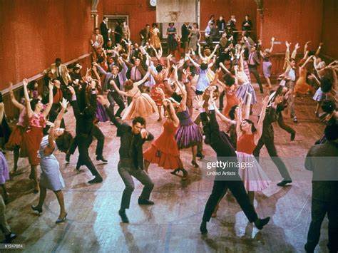 1961 Young Men And Women Dance With Their Arms Thrust Into The Air