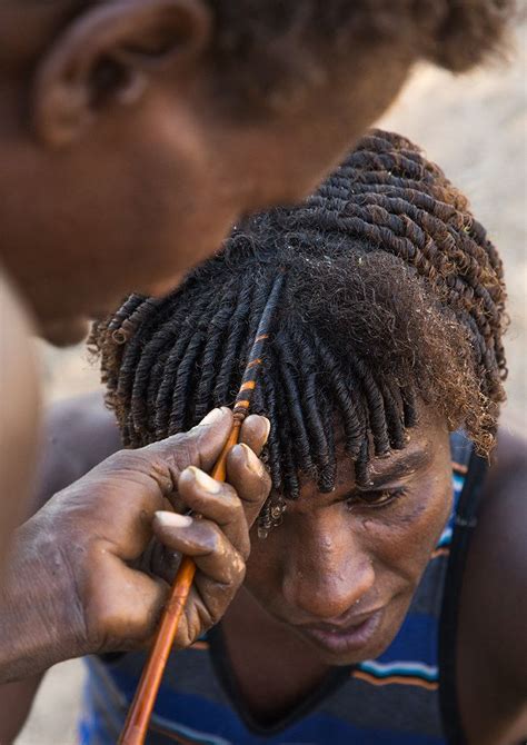 Afar Man Having A Traditional Hairstyle With A Stick To Make Curly Hair