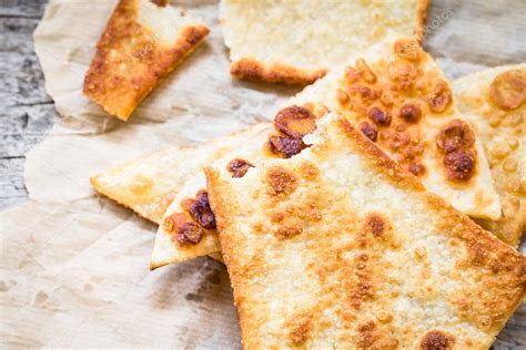 Crunchy Pizza Dough Triangles On Rustic Background Stock Photo By