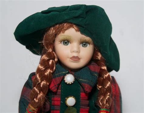 Collectible Porcelain Doll In Green Dress Ebth