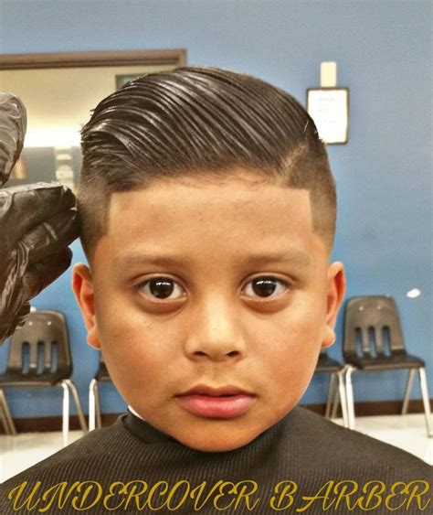 Presenting to you, slicked back with a pompadour and a lot of style in just one picture. 40 Cute & Easy Hairstyles for School Boys 2018 - AtoZ Hairstyles