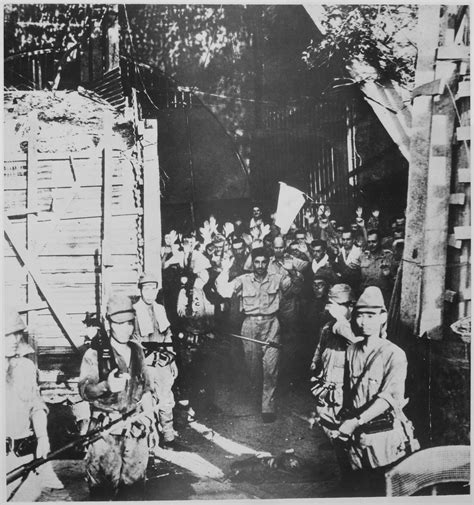 World War Ii Pictures In Details American Pows Reenact Surrender Of