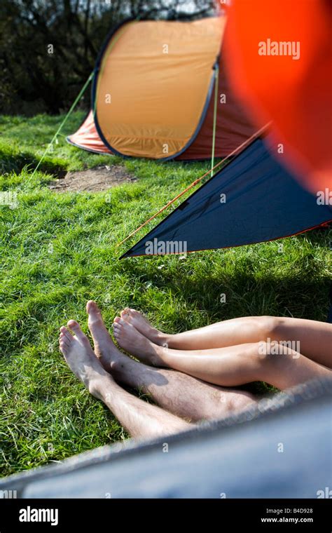 Couple With Feet Sticking Out Of Tent Stock Photo Alamy