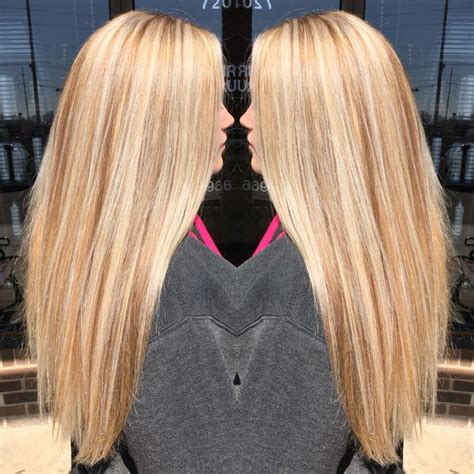 Liven things up with a variety of highlights and low lights that include various hues ranging from platinum to strawberry. Golden blonde base with platinum highlights and neutral ...
