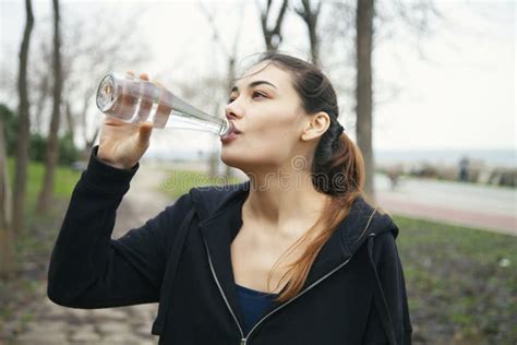 Girl Drinking Water From Bottle In Outdoors Stock Image Image Of Outdoor Bottle 210345515