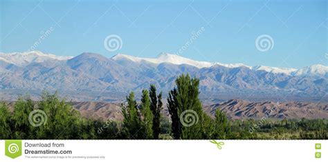 Green Valley And Snow Mountains On Horizon Stock Photo Image Of Hill