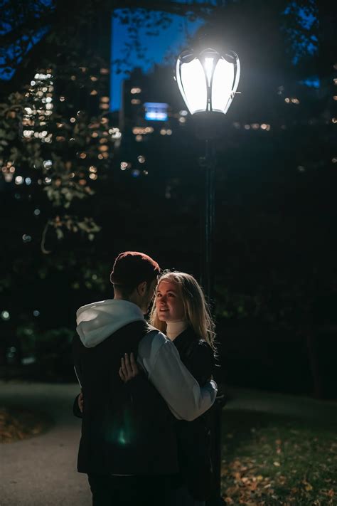 Romantic Couple Hugging In Park At Night · Free Stock Photo