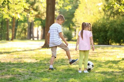 Cute Little Children Playing Football Outdoors Stock Photo Image Of