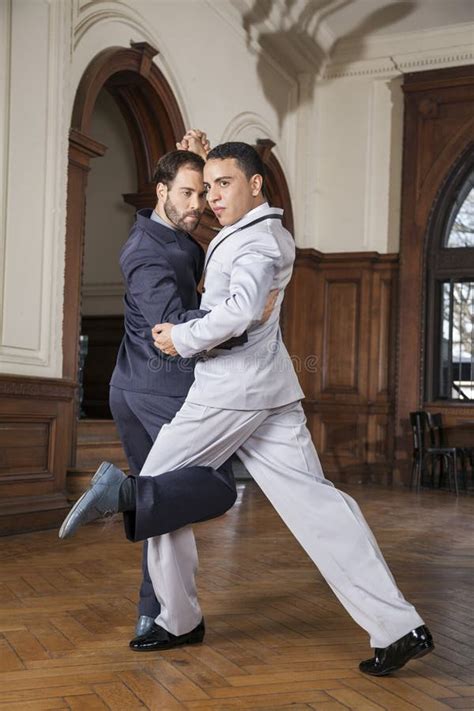 Confident Male Tango Dancers Performing Gancho Stock Image Image Of