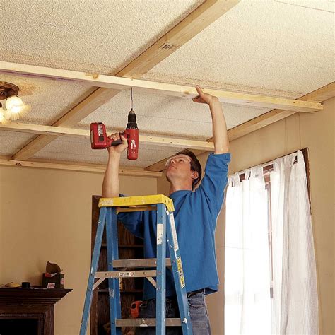 Measure, cut, paint and install border boards. Ceiling Panels: How to Install a Beam and Panel Ceiling