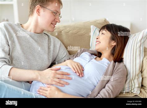 Happy Pregnant Wife With Husband At Home Stock Photo Alamy
