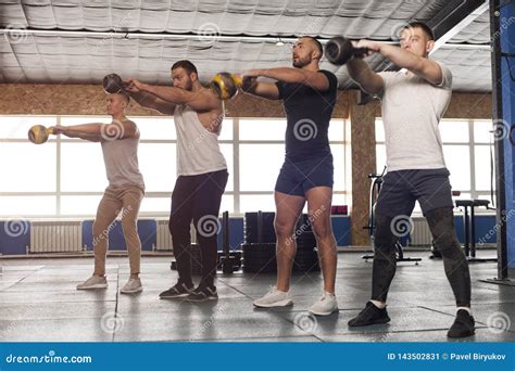 Group Of Male Muscular Friends Working Out In Gym Stock Image Image
