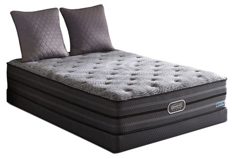 The upgrades to the standard mattress add layers, which change . Simmons Beautyrest Black Radiance Luxury Firm - Mattress ...