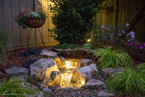 Landscape collaboration is an integrated landscape design company. Backyard Waterfall with lights | Brookside Landscape Design