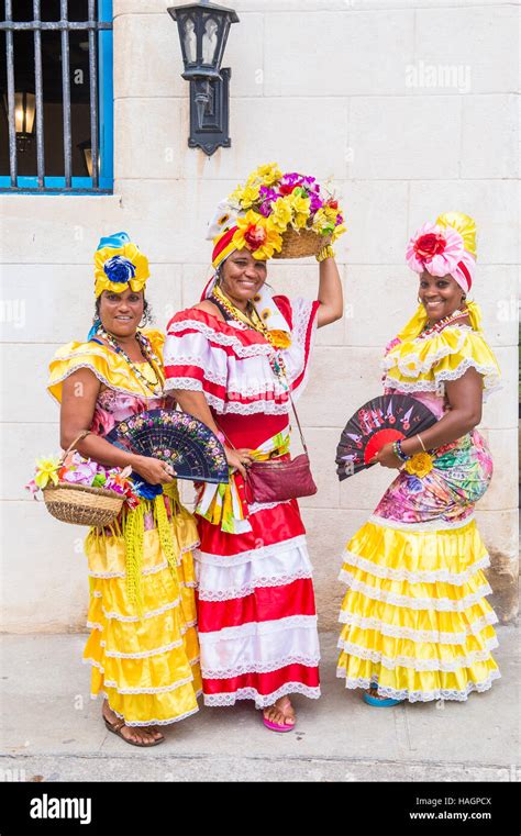 Cuban Women With Traditional Clothing In Old Havana Street The