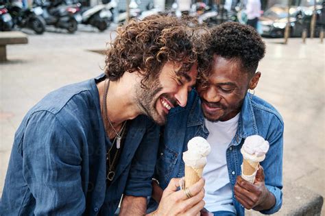 Happy Gay Couple Enjoying Ice Cream Stock Photo