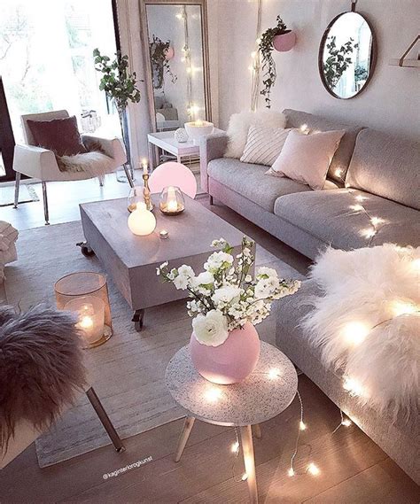 A Living Room Filled With Lots Of Furniture And Lights On The Wall