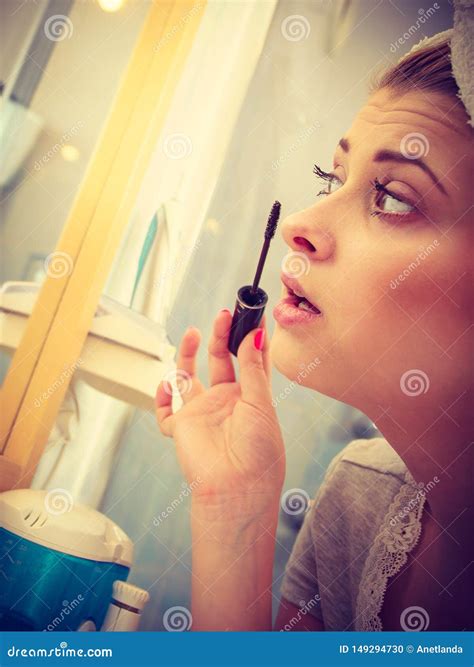 Woman In Bathroom Applying Mascara On Eyelashes Stock Photo Image Of