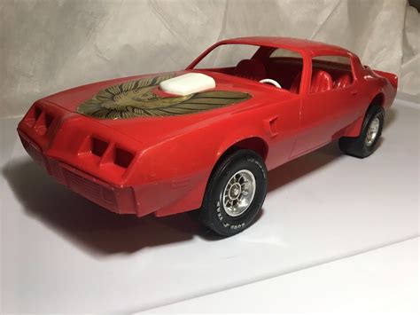 If you have a ruler on hand, 7 mm is close to (but not exactly) 1/4 of an inch. Vintage 1970's Red Pontiac Trans AM Toy Car Processed ...