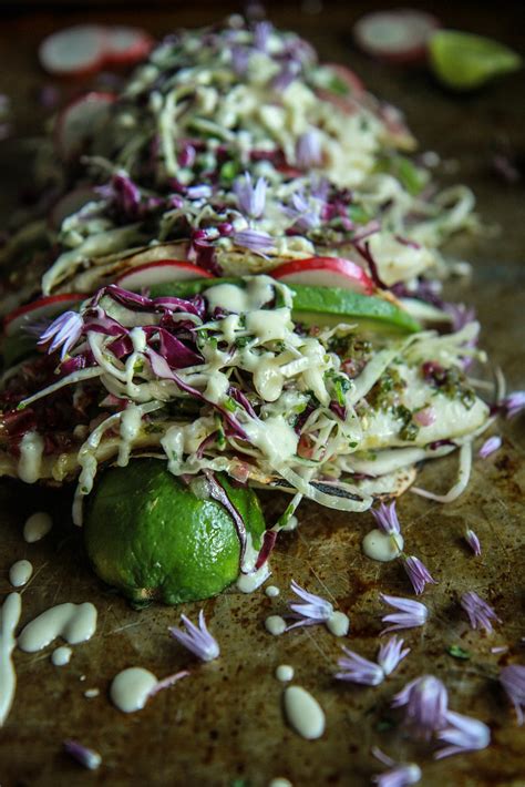 These grilled fish tacos are easy and healthy and made with lime, tequila, cabbage, and cilantro. Citrusy Grilled Fish Tacos with Citrus Slaw and Orange ...