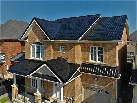 Metal roofs can be loud during rainstorms or hail. Black Metal Roof in Ajax - Metal Roof Experts in Ontario, Toronto, Canada.