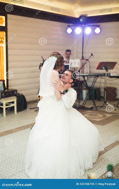 First Wedding Dance Of Newlywed Couple In Restaurant Stock Image