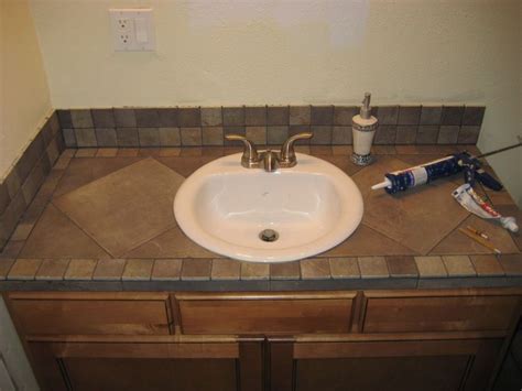 Whereas tile countertops and laminate countertops were popular before, granite countertops are extremely popular these days and for good reason. Bathroom vanity tile countertop ideas | Tiled countertop ...