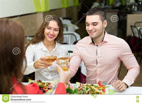 Friends Celebrates Holiday In Restaurant Stock Image ...