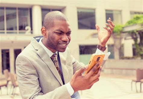 Frustrated Business Man Receiving Bad News On Mobile Phone Stock Photo