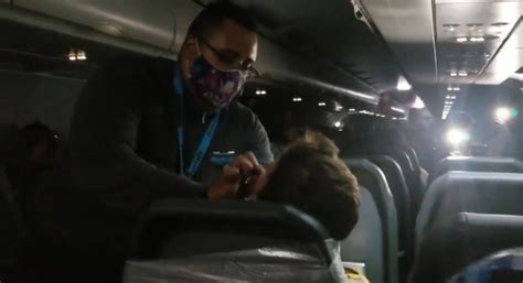 frontier airlines crew duct tapes belligerent passenger to seat after he gropes female flight