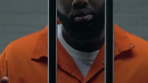 Dangerous African American Criminal Holding Prison Bars Imprisonment