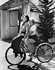 Joan Blondell And Sister Riding Bicycle by Bettmann