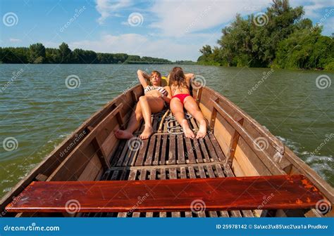 Cute Teenage Girls Sunbathing On The Boat Stock Photography