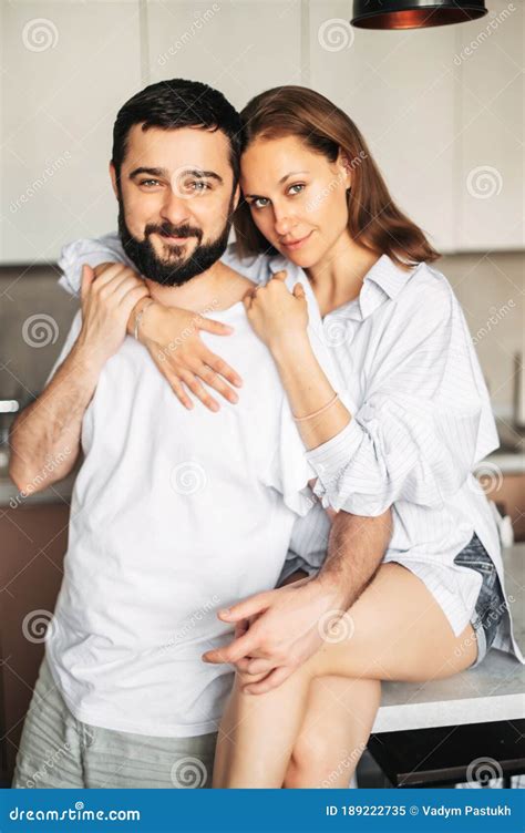 A Married Couple In Love Hugging In The Kitchen Stock Image Image Of