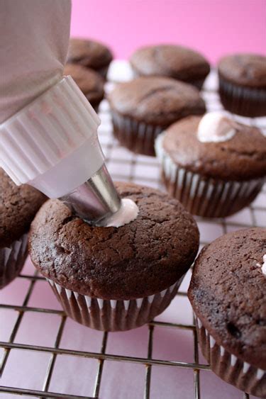 Mix cream cheese, butter and sugar using an electric mixer. Cream Filled Chocolate Cupcakes with Chocolate Ganache ...