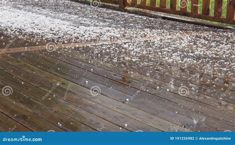 Wet Wooden Terrace After Strong Summer Hail Storm Covered By White
