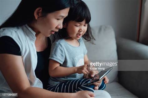 Asian Kids Playing Phone Photos And Premium High Res Pictures Getty