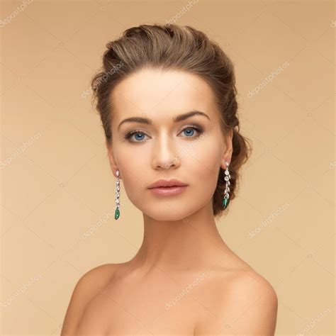 Woman With Diamond And Emerald Earrings — Stock Photo © Syda