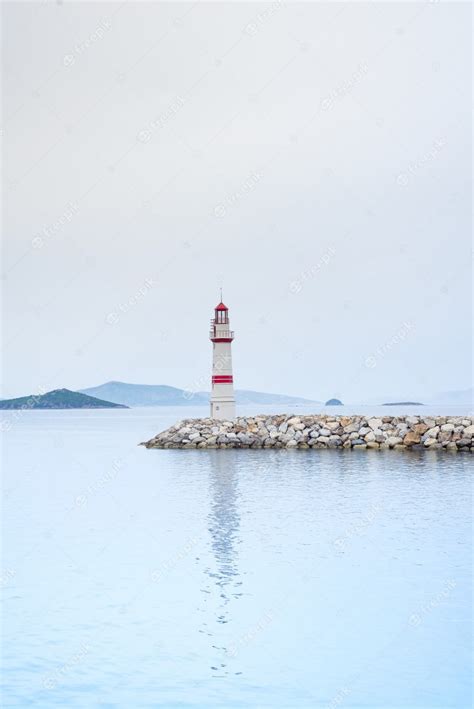 Premium Photo Lonely Lighthouse On A Stone Road In The Middle Of The