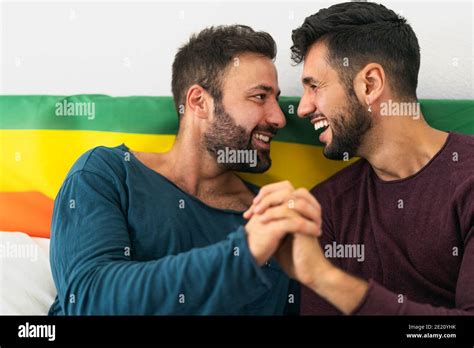 Happy Gay Couple Having Tender Moments In Bedroom Homosexual Love