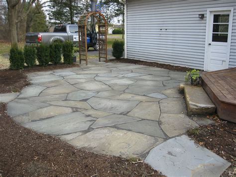 After the patio is firm enough to walk on, spread stone dust over the stones and sweep it into the joints and along the edge. More Stone Patio Pictures - Natural Flagstone Patios and ...