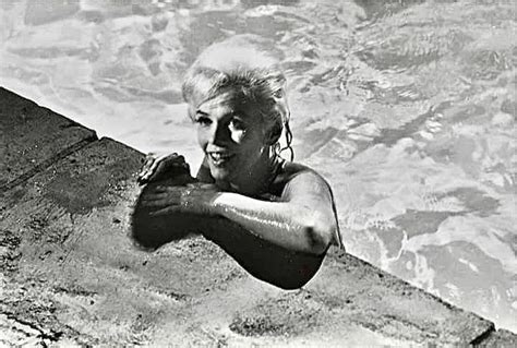 marilyn coming up from her dip in the pool on set photo by lawrence schiller 1962