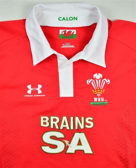 Notes super heavyweight (400g / 14 oz.) red rugby jersey with embroidered prince of wales' feathers. WALES RUGBY UNDER ARMOUR SHIRT S Rugby \ Rugby Union ...