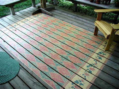 And add a painted rug design on the deck. Rug stenciled on an outdoor deck | walltowallstencils.com