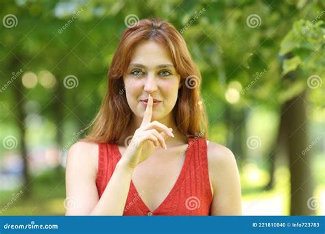 Happy Woman Asking For Silence In A Park Stock Photo Image Of Mouth