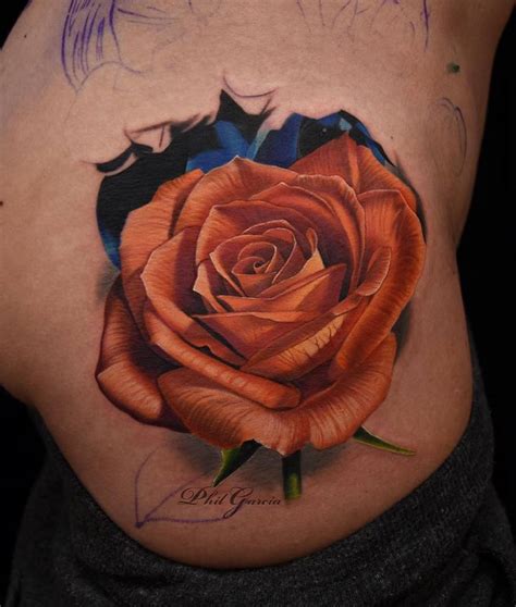 Orange Rose Tattoo On The Right Side Of The Hip