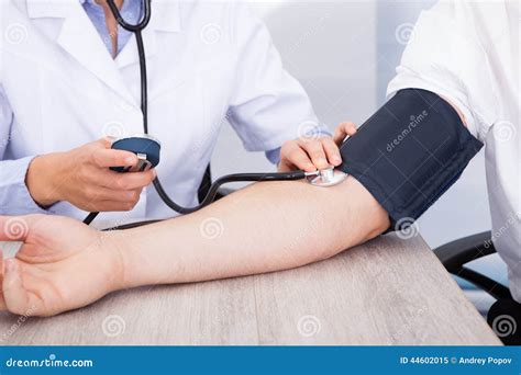 Doctor S Hand Checking Blood Pressure Stock Image Image Of Checkup