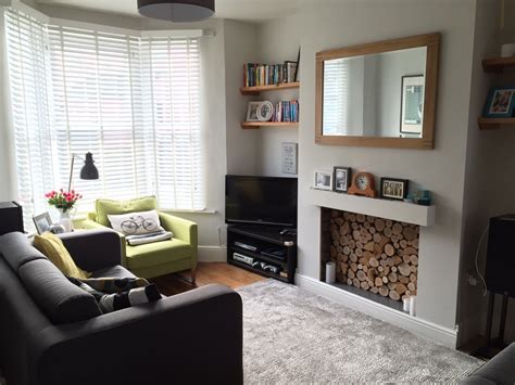 A Beautiful Front Room Finished Off With The Fireplace Filled With