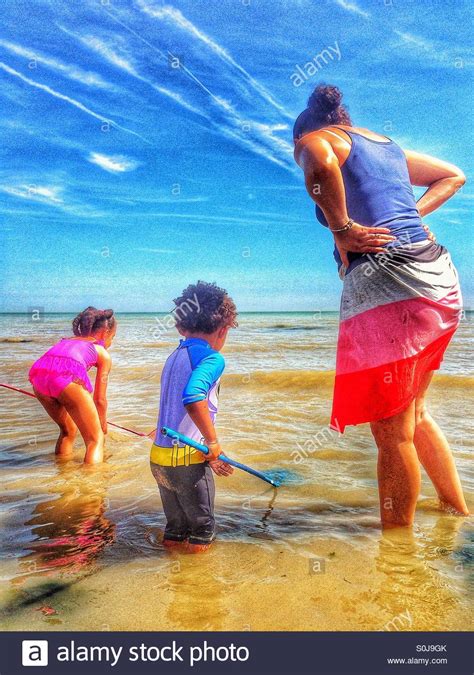 Mother And Children At The Beach Stock Photo Alamy
